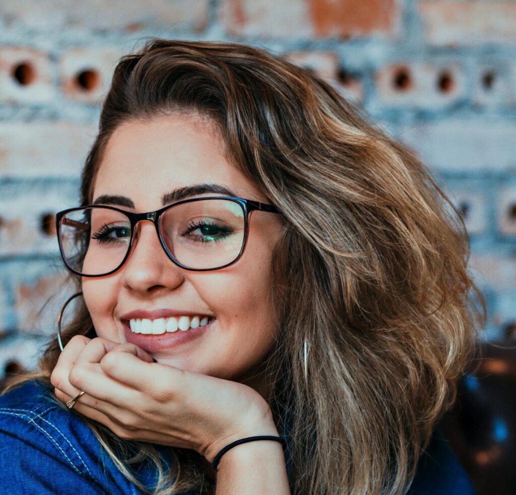 woman smiling after receiving restorative dentistry Manhattan