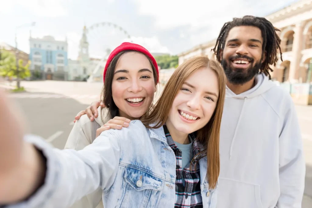 friends smiling while being outdoors