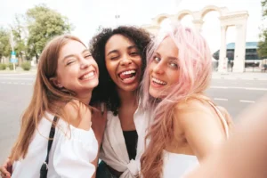 three young smiling women